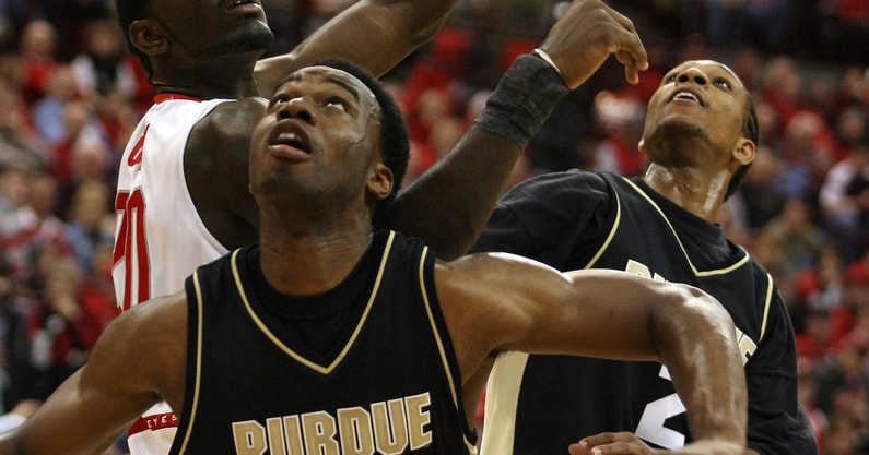 Purdue's Carl Landry (center) and David Teague